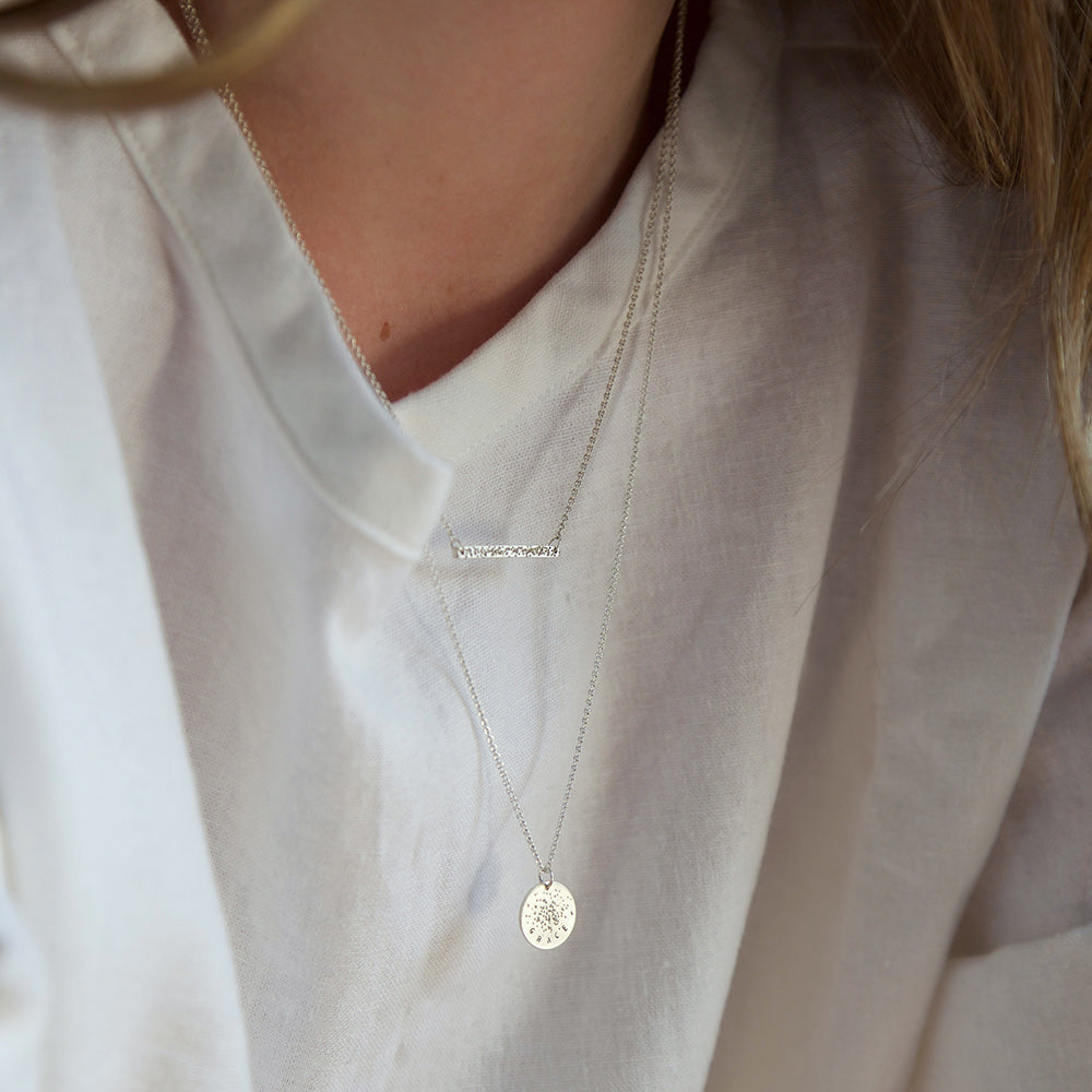 silver diamond dusted necklaces layered on model