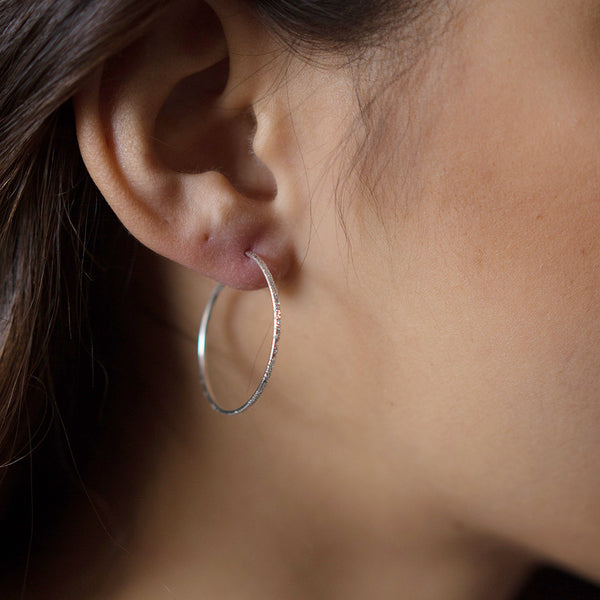 silver diamond dusted hoops on model | christina kober