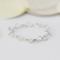 CONNECTED HEART CHAIN RING
