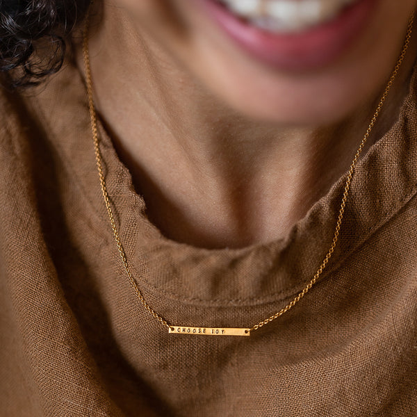choose joy gold bar necklace on model