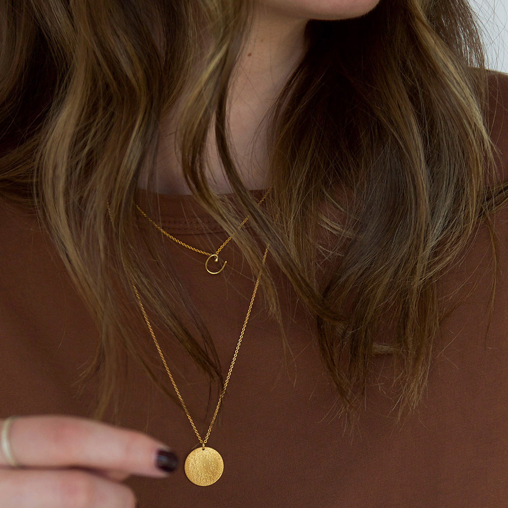 layered necklaces on model