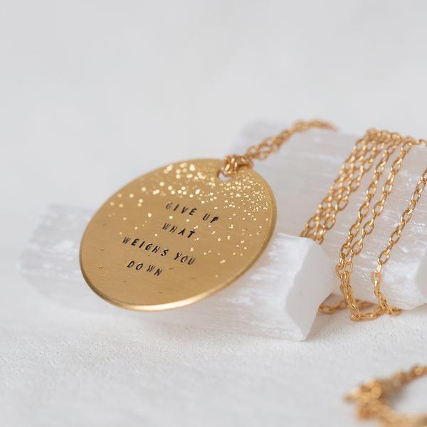 give up what weighs you down gold large coin necklace