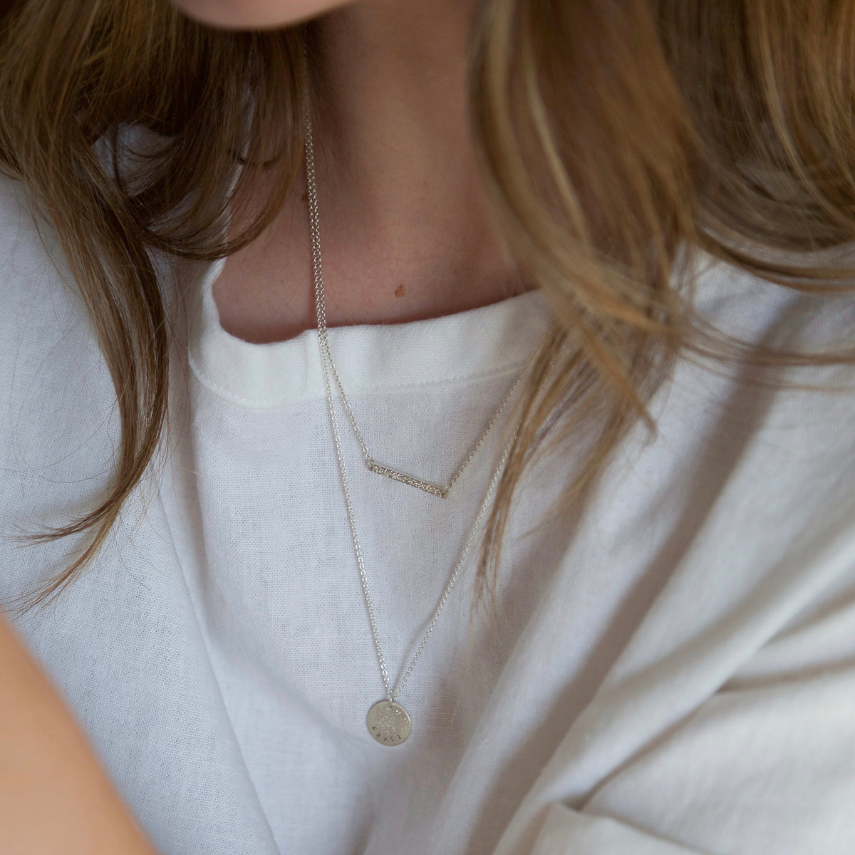 sterling silver layered necklaces on model | christina kober