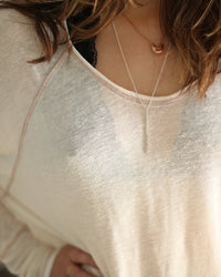 silver long bar necklace on model