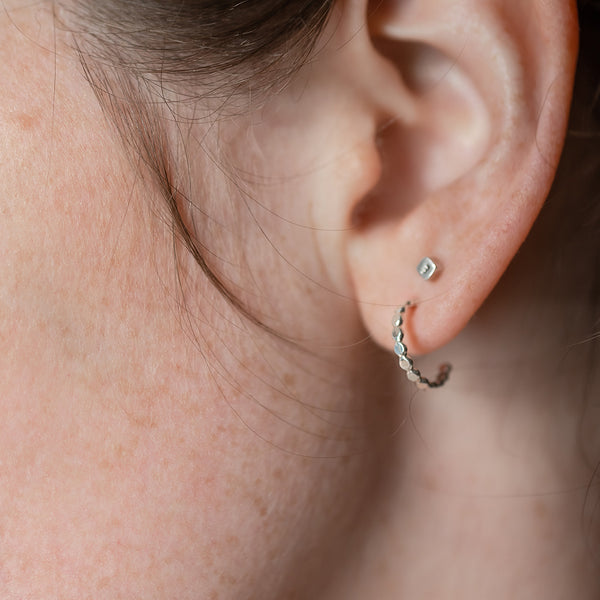 sparkle huggie hoop in ear